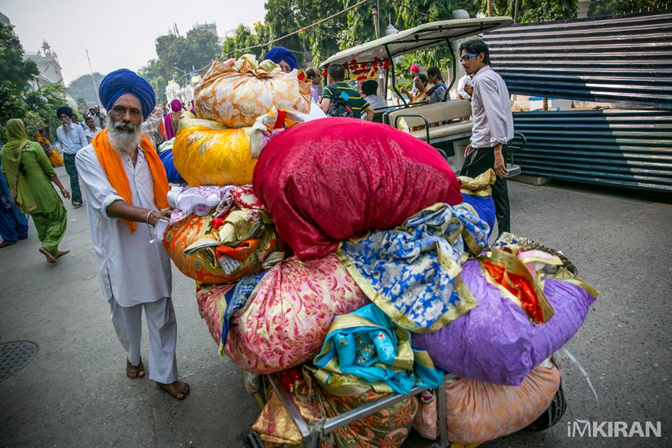The donated clothes being taken our of the temple grounds, I hope this will be donated to the poor or for better use. 