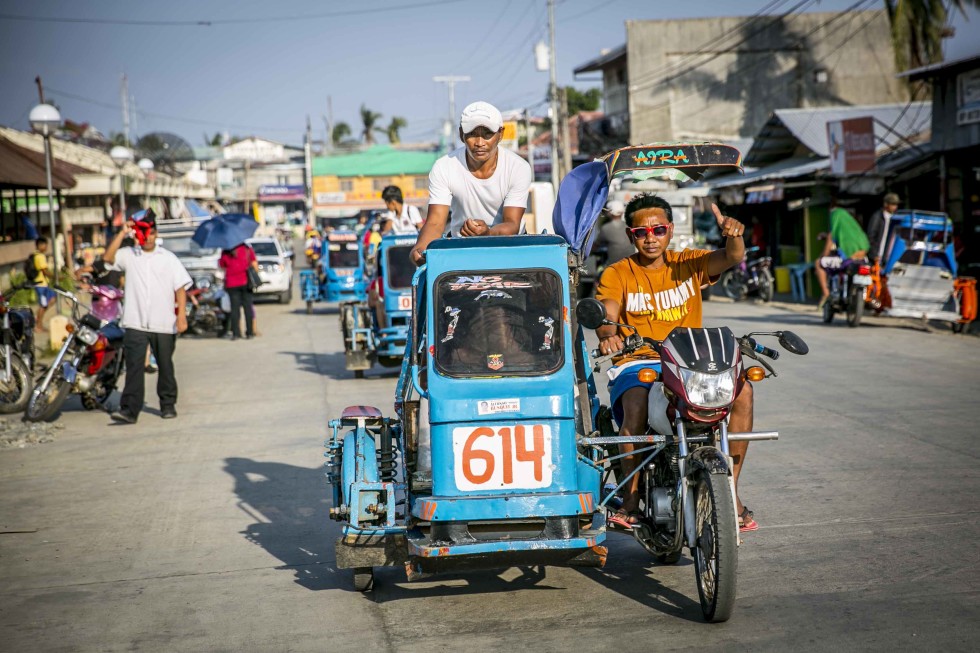 A tricycle passing by at the local town called Pontevedra - Capiz.