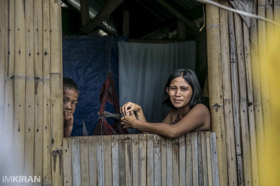 They spend time sitting at home with their children as there is nothing much to do here.