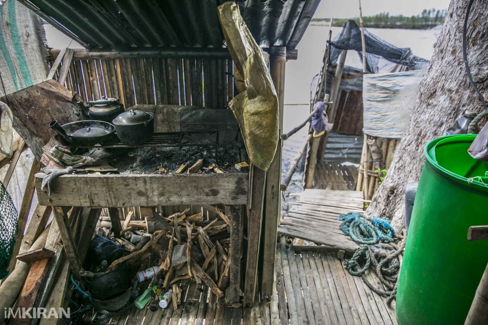 Here is how the kitchen looks like, and at the background is the toilet and bathroom. This is from inside her house. The waste from the toilet doesnt go anywhere.