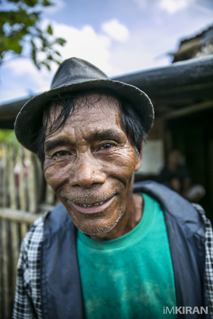 This is one of the Diaz brothers, age 64. He is a construction worker in a village of Panay Island, he lost his home and is awaiting to build a new home again. He has been living on the same land for about 30 years. He has a pig and some chickens. After Haiyan Typhoon, Panay Island, Philippines