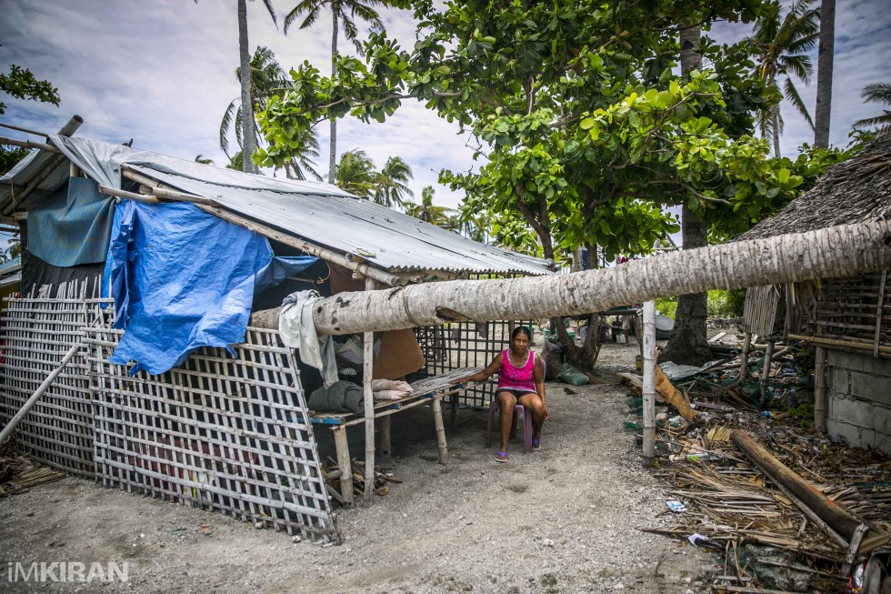A tree trunk that landed on her home, thankfully she survived. - Baliguian Island, Panay - Philippines