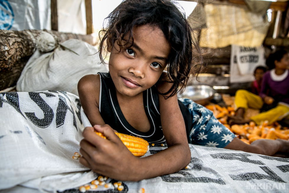 The Ati children here help with daily chores until the sun sets, then they play in the dark with torchlights as they don't have power in their homes.