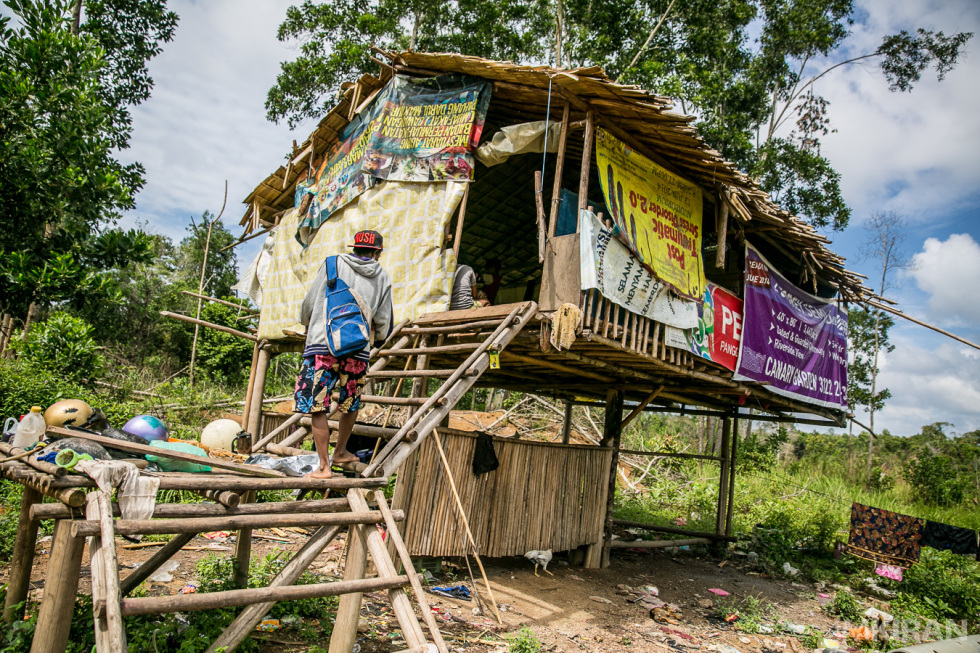 A house that is made of scrap wood and plastic street banners collected by the dumps or some donated. - Jakun Tribe, Pahang